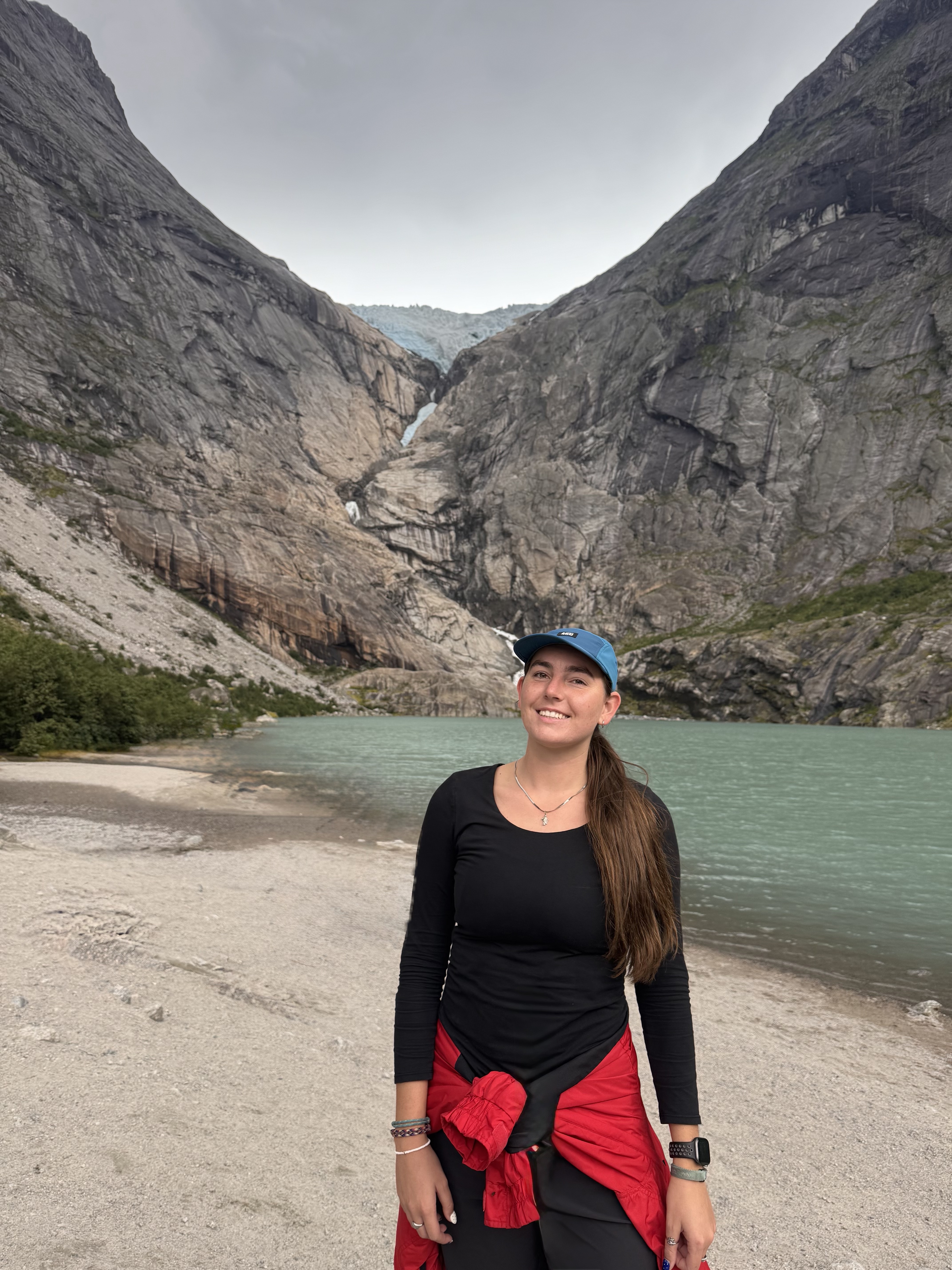 Paetan standing beside a glacial lake in Norway
